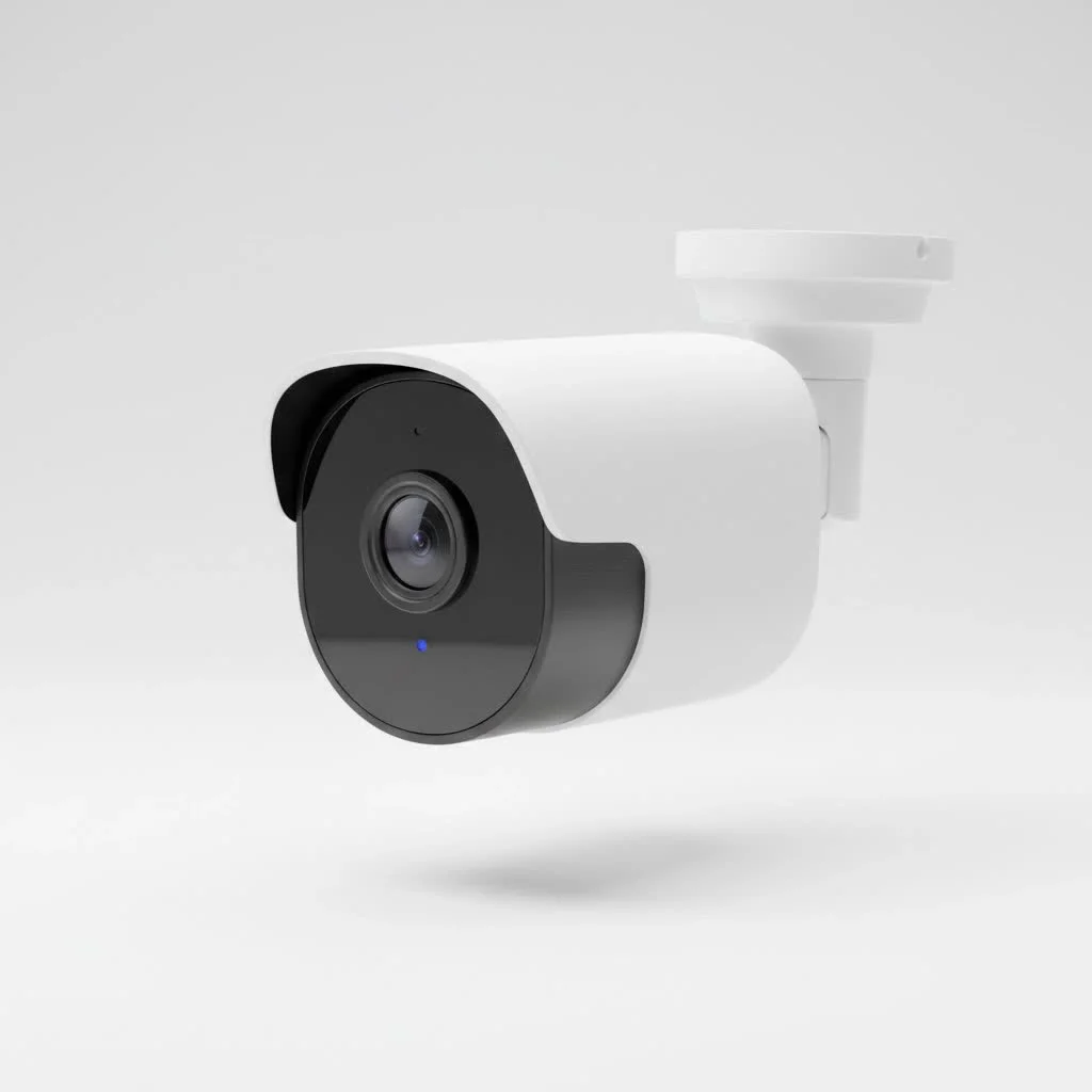 Security camera placed on a windowsill looking out a window